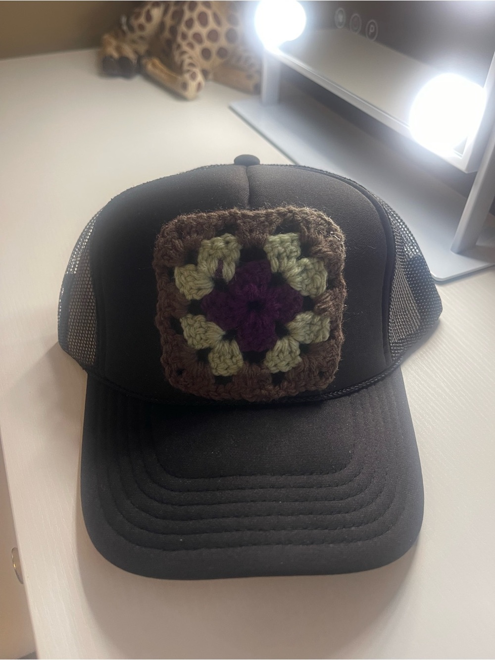 Black Trucker Hat with Crocheted Patch